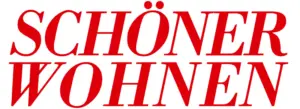 ALT-Text: Rotes Logo mit dem Schriftzug „SCHÖNER WOHNEN“ in versalhaften Buchstaben auf weißem Hintergrund.