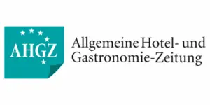 Logo der All­ge­meinen Hotel- und Gastronomie-Zeitung (AHGZ) mit Text und Sterne-Elementen in turquoise und schwarz.