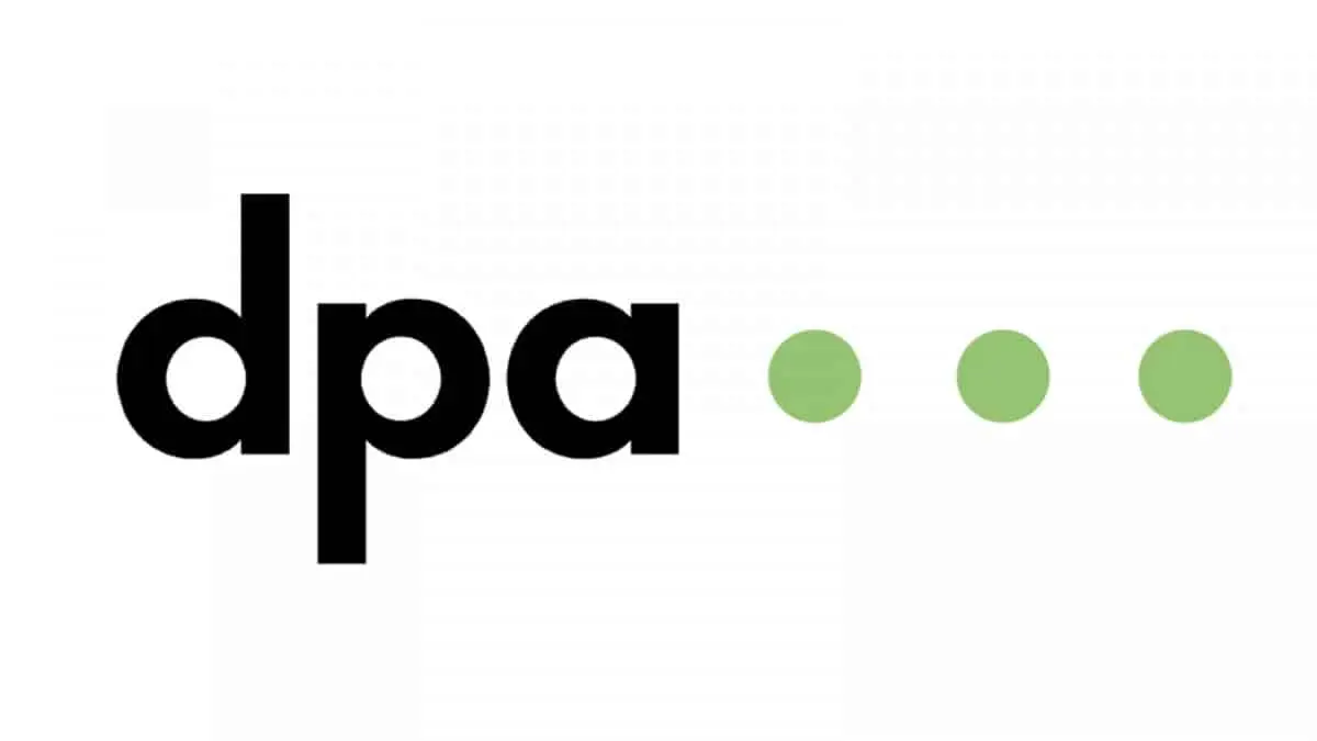 Logo der dpa: schwarze Buchstaben „dpa“ mit drei grünen Punkten dahinter auf weißem Hintergrund.