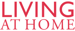 ALT-Text: Roter Schriftzug „LIVING AT HOME“ in Großbuchstaben auf weißem Hintergrund, symbolisiert Wohn- und Lebensstil.
