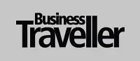 Logo der Publikation Business Traveller auf grauem Hintergrund. Fokus auf Geschäftsreisen und -kultur.