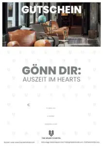 ALT-Text: Gutschein für Auszeit im The Hearts Hotel, mit stilvollem Innenraum und gemütlichen Sesseln.