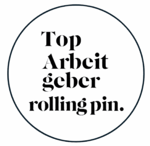 ALT-Text: Textgrafik mit den Worten „Top Arbeitgeber rolling pin“ in einem runden Rahmen auf grünem Hintergrund.